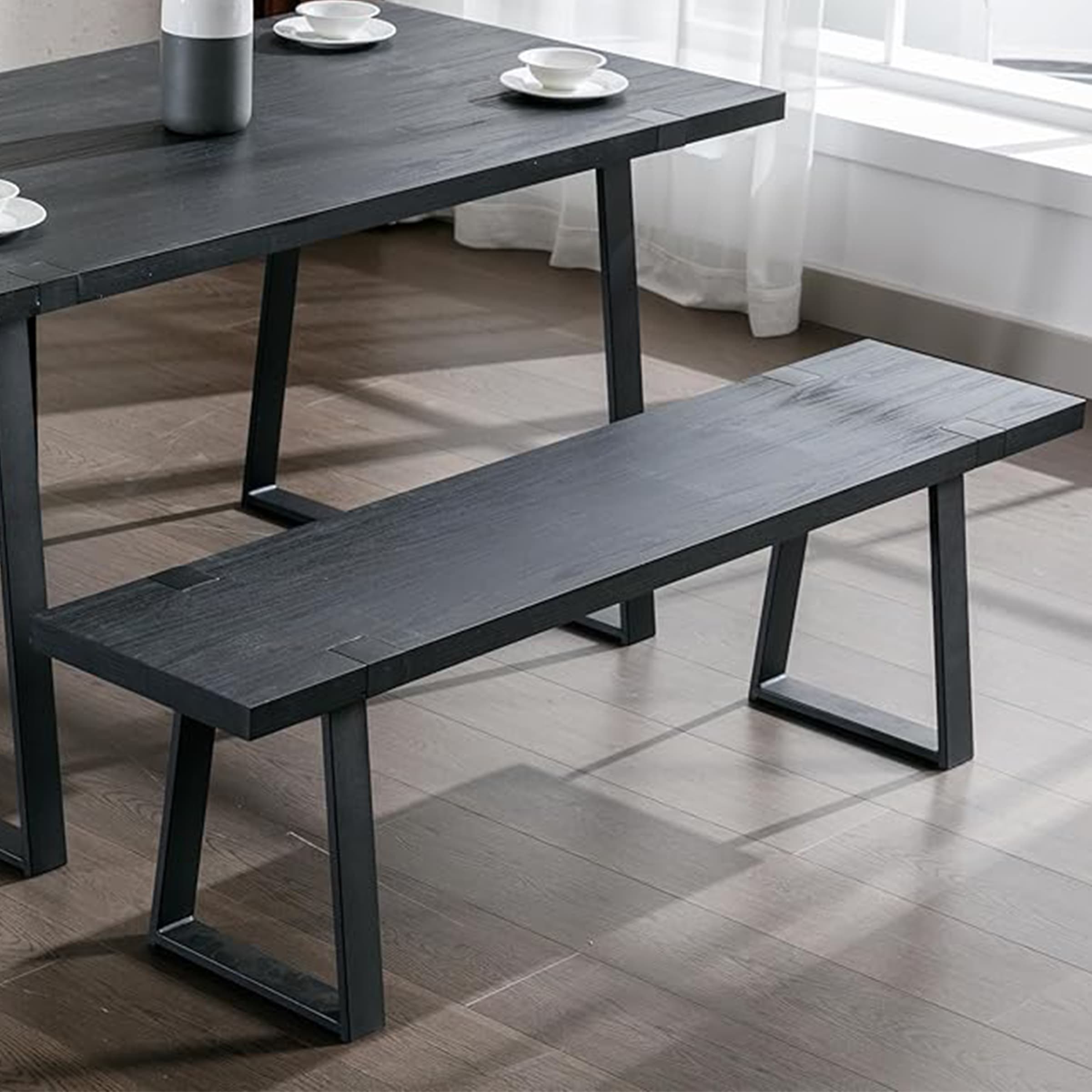 Dining bench and table with plates on top