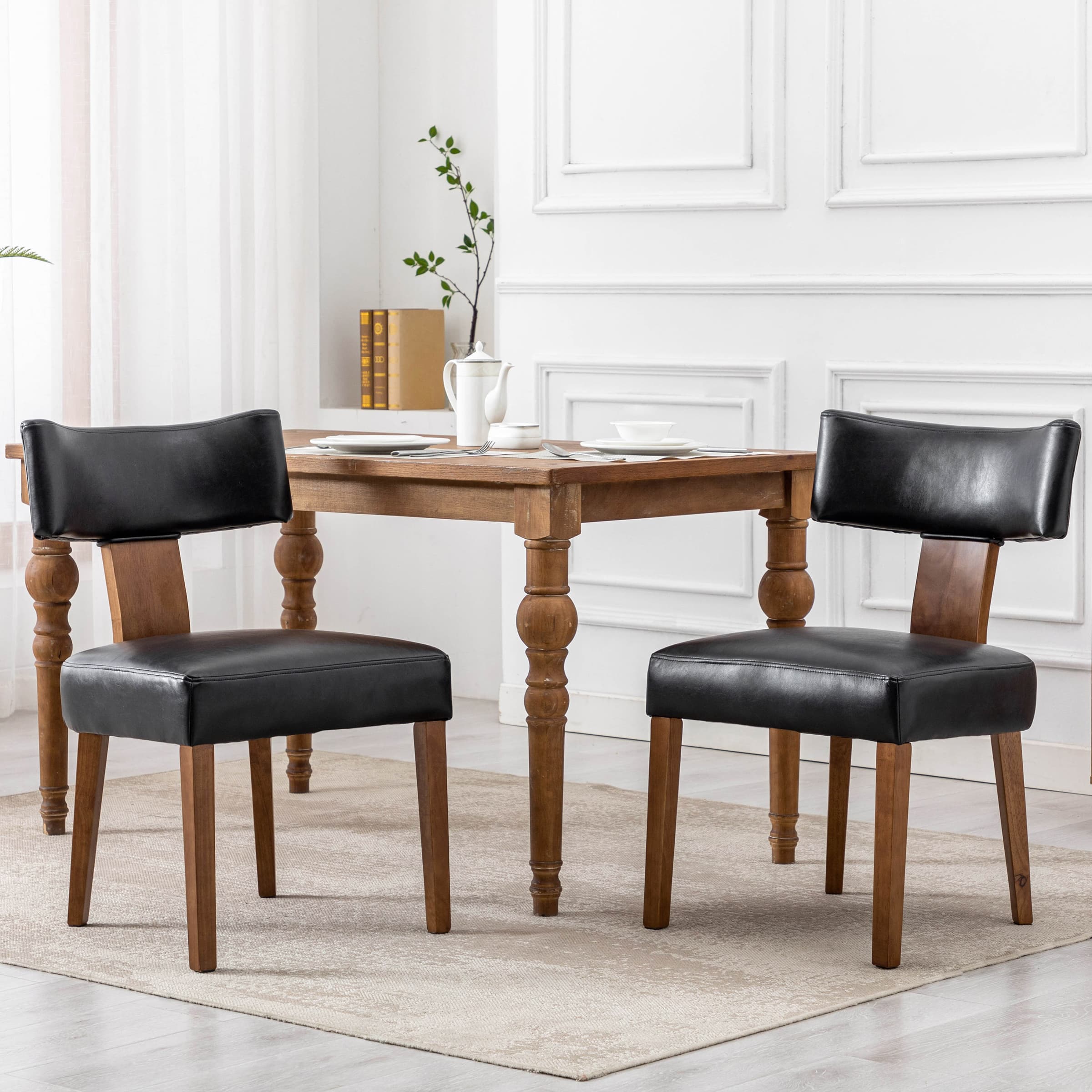 Chairs around a table in white room